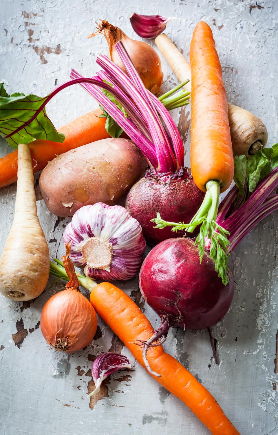 Fresh root vegetables — carrots, beets, parsnips, onions and garlic